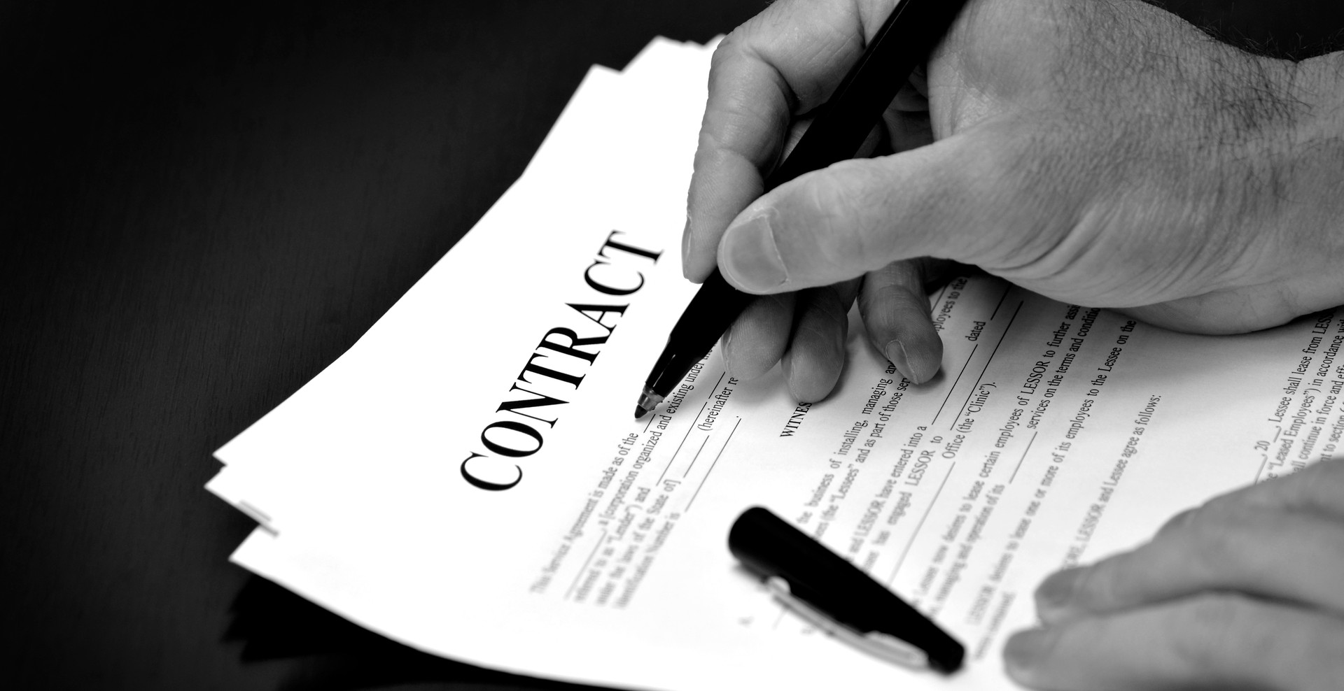 Contract on Desk Signed by Person